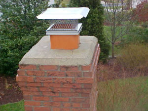 masonry chimney with new crown