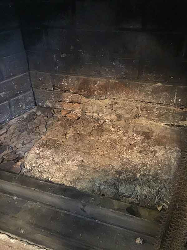 Cracked refractory panels on the bottom of the firebox as well as the sides.