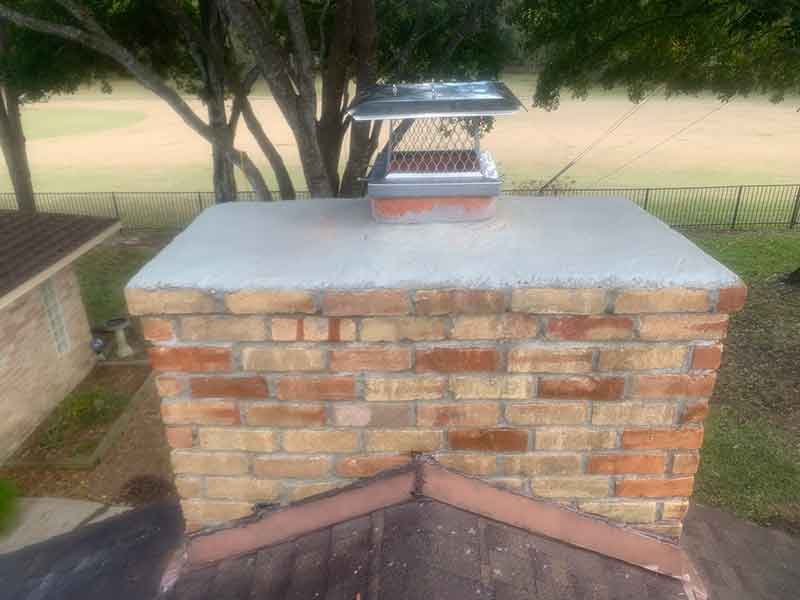After chimney repairs-clean brick, no smoke damage, new tuckpointing and crown