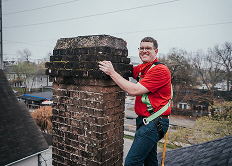Lee standing next to chimney on roof - Lords Chimney