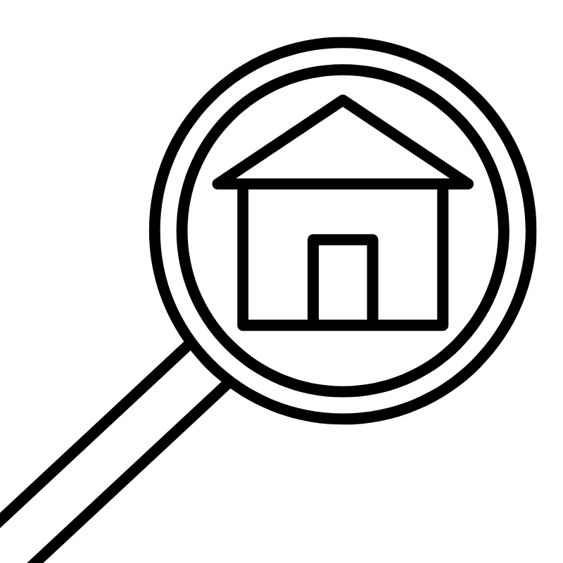 magnifying glass looking at a home