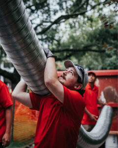 Crew holding chimney liner